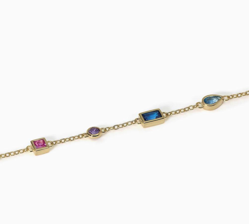 Pulsera Mabina en circonitas multicolor para mujer en plata bañada en oro de 18k con cadena de eslabones y biseles de diferentes cortes. 1