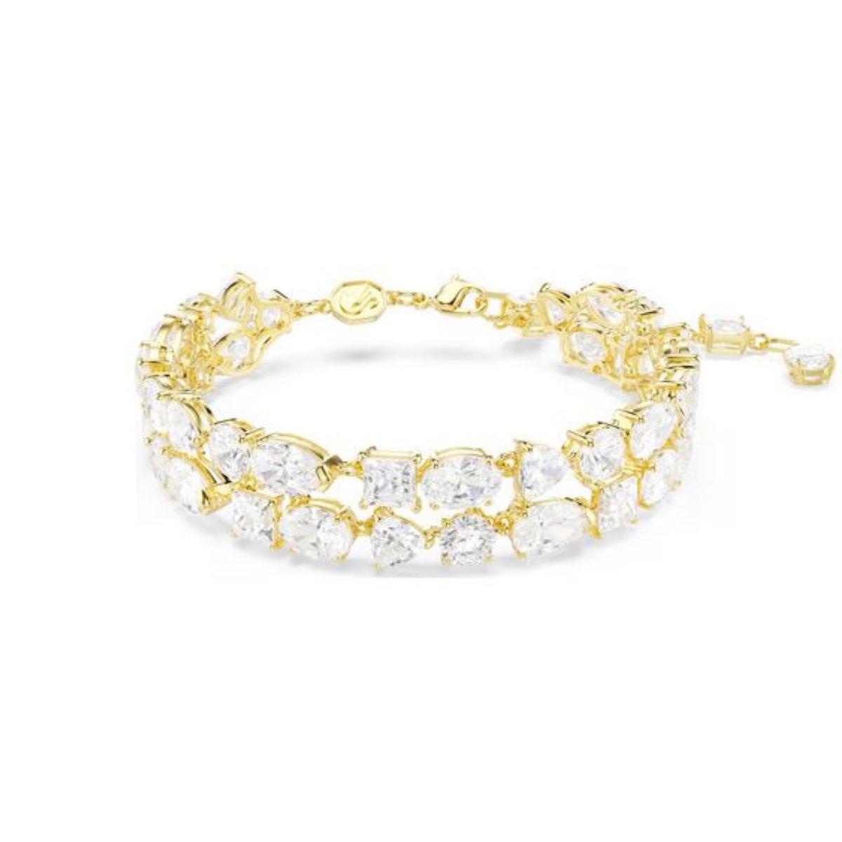 PULSERA SWAROVSKI MESMERA CON BAÑO TONO ORO Y CRISTALES BLANCOS 5743827